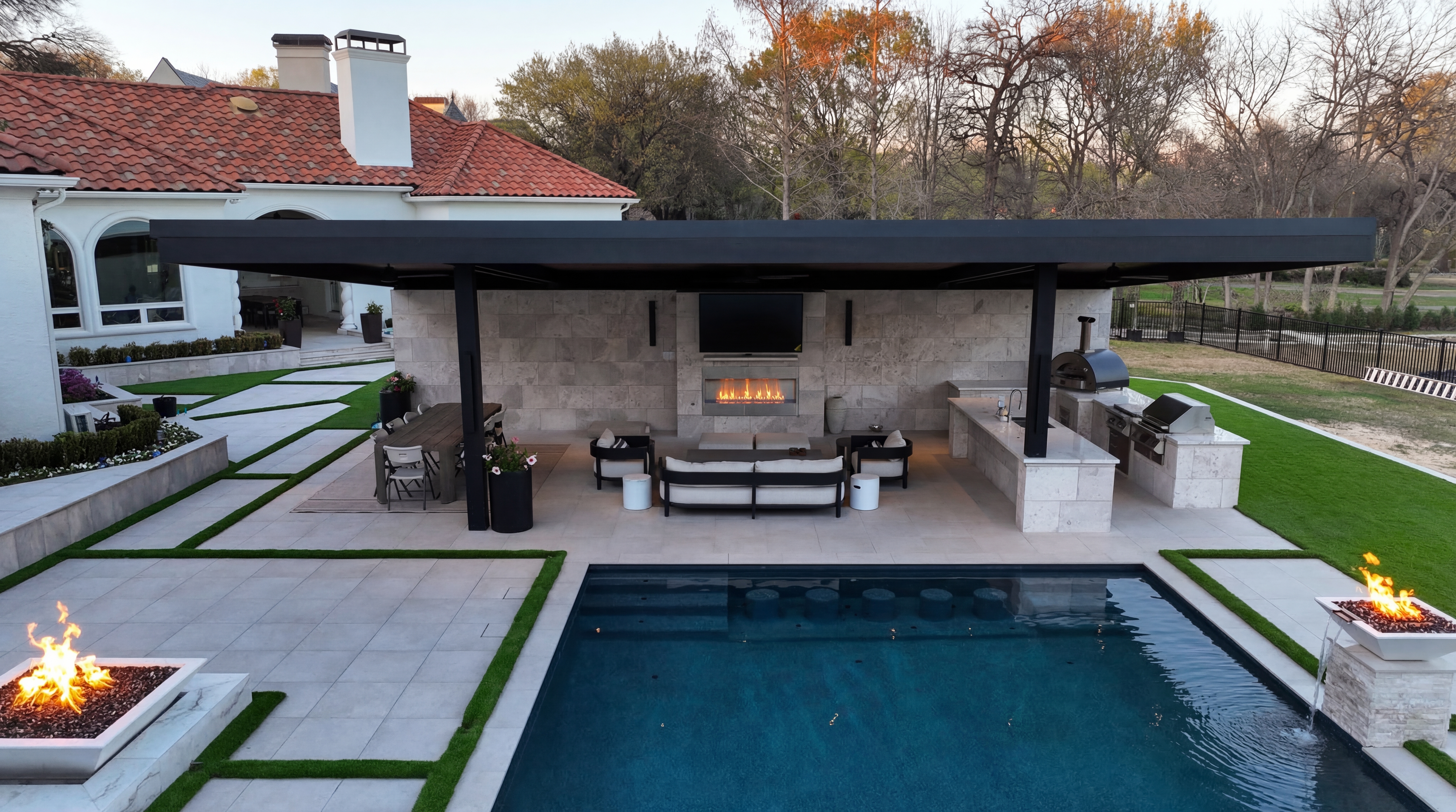 Resort-style backyard with pool, spa, outdoor kitchen, and fire features