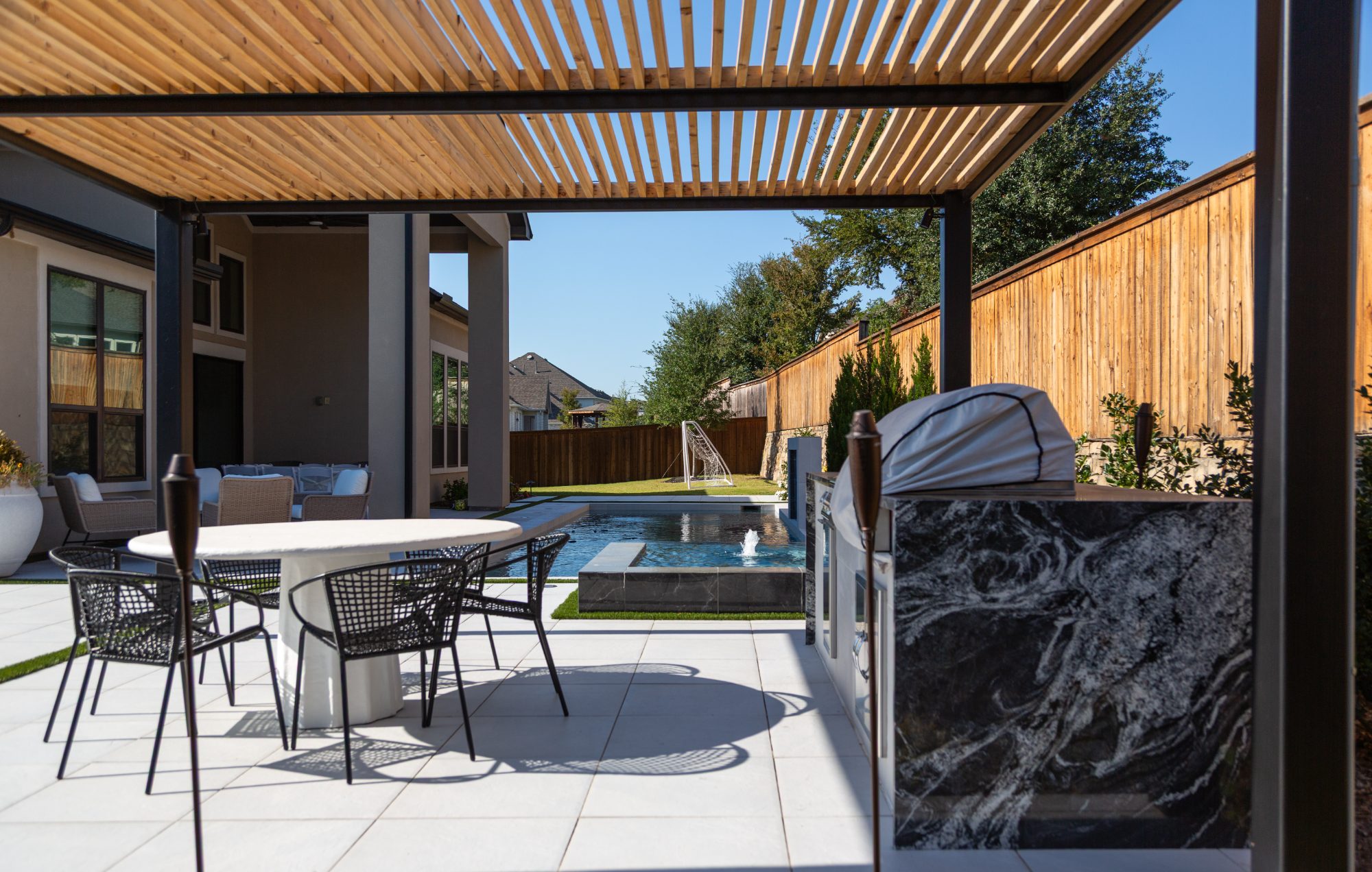 Modern Dark Marble Pool with Spa, Pergola & Outdoor Kitchen — Prosper, TX — photo 9