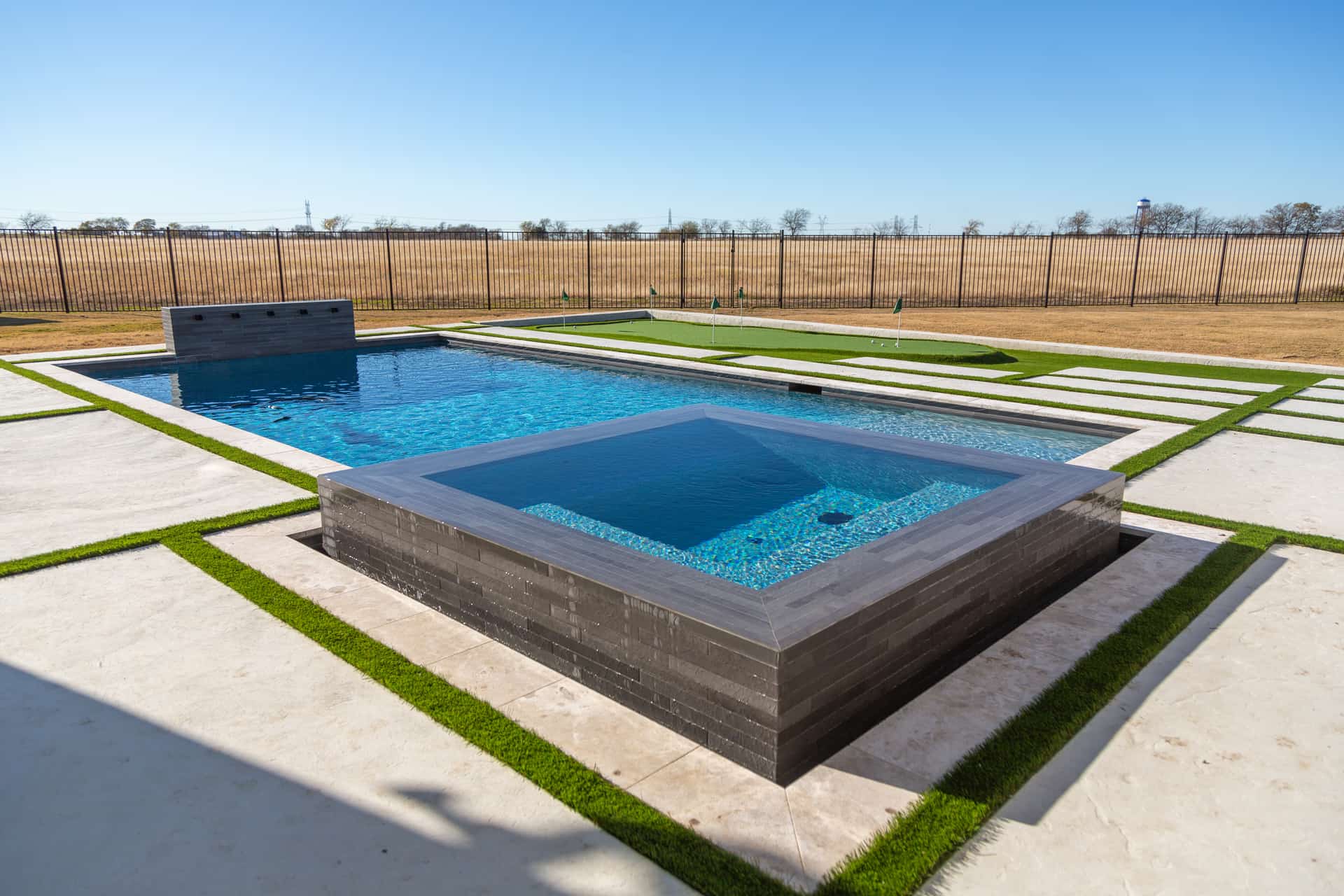 Geometric Pool with Raised Spa, Water Wall & Putting Green — Prosper, TX