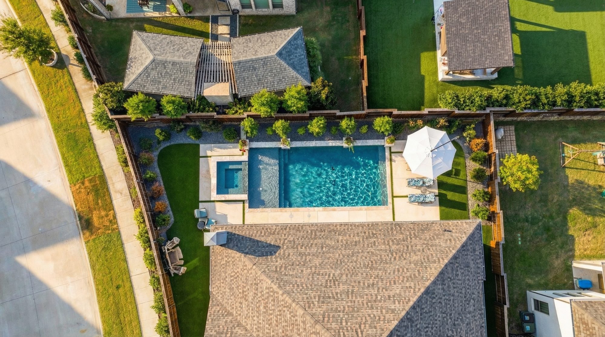 Geometric Pool & Spa with Night Transformation — Prosper, TX — custom geometric pool by Prestige Pool & Patio