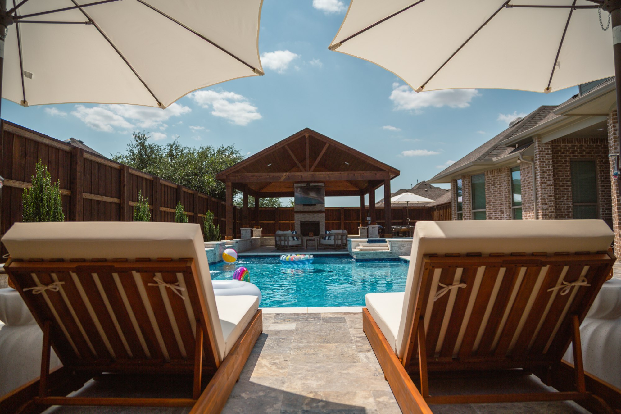 Modern Pool with Luxury Loungers & Outdoor Living — Prosper, TX — custom pool by Prestige Pool & Patio in Prosper, TX