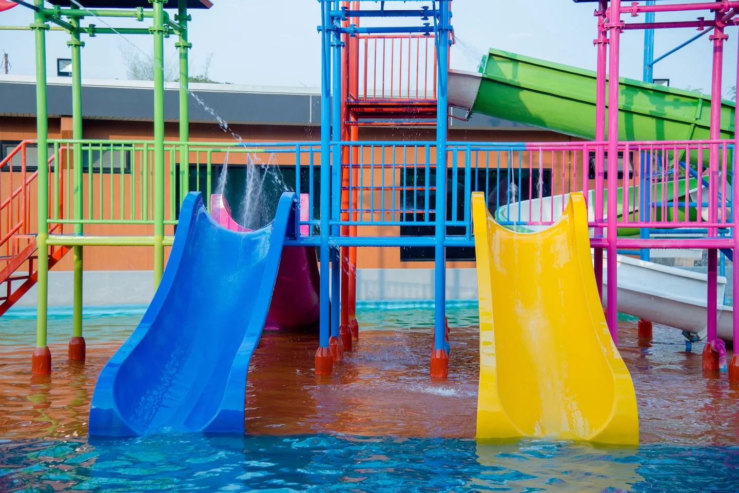 colourful-plastic-slides-water-park-sunlight