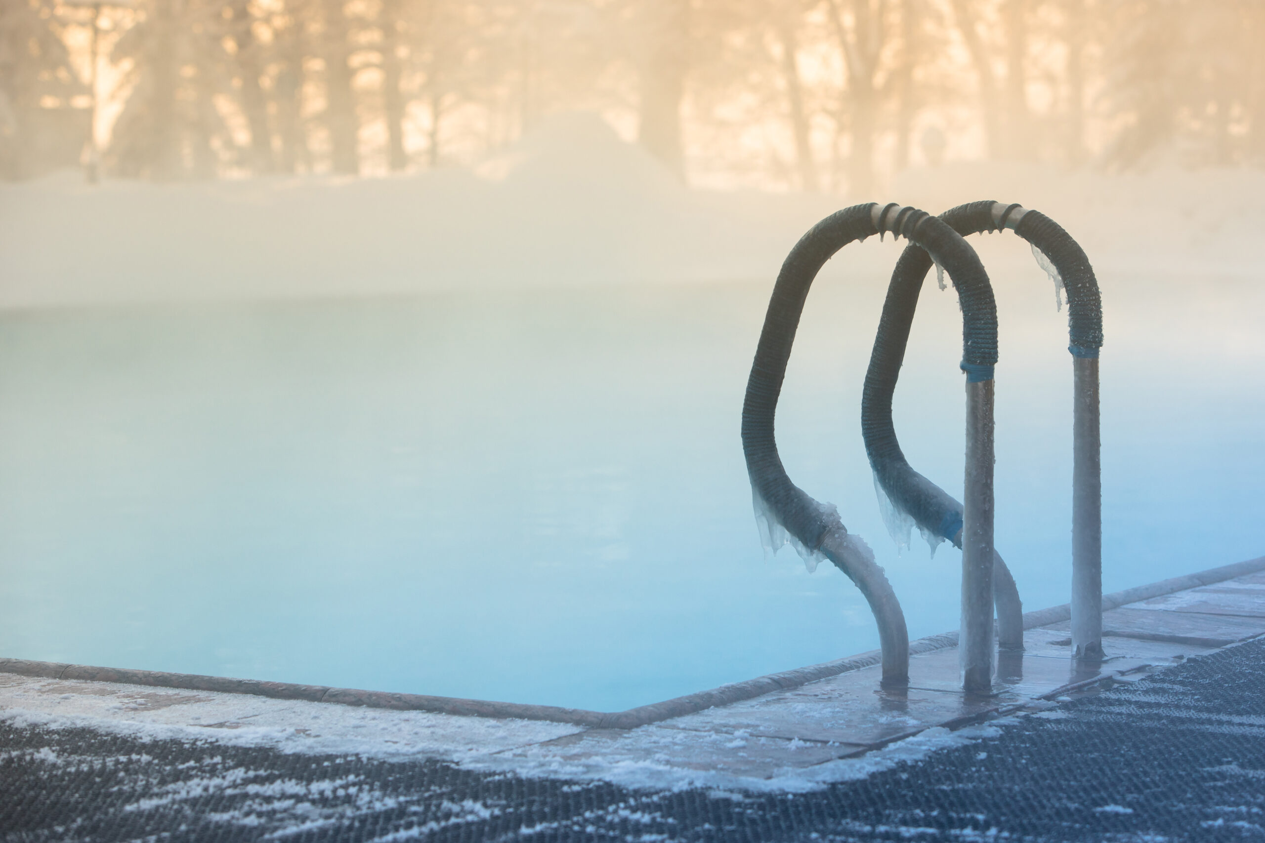 Warm swimming pool hand rail in frosty weather, outdoor, soft fo